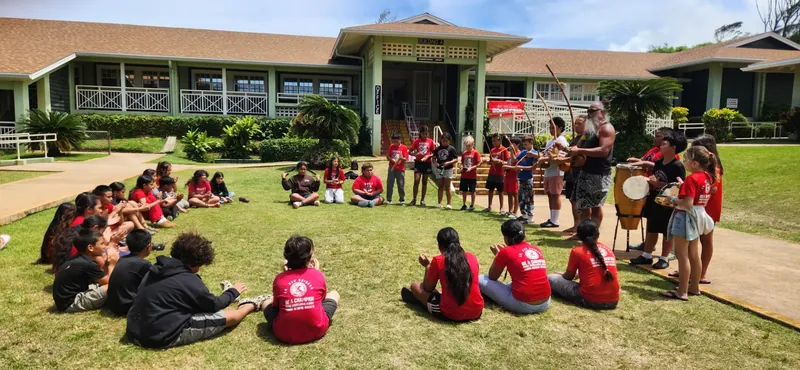 Fourth-grade students participating in outdoor music and movement programming through the M&M Project at Kahuku Elementary School.