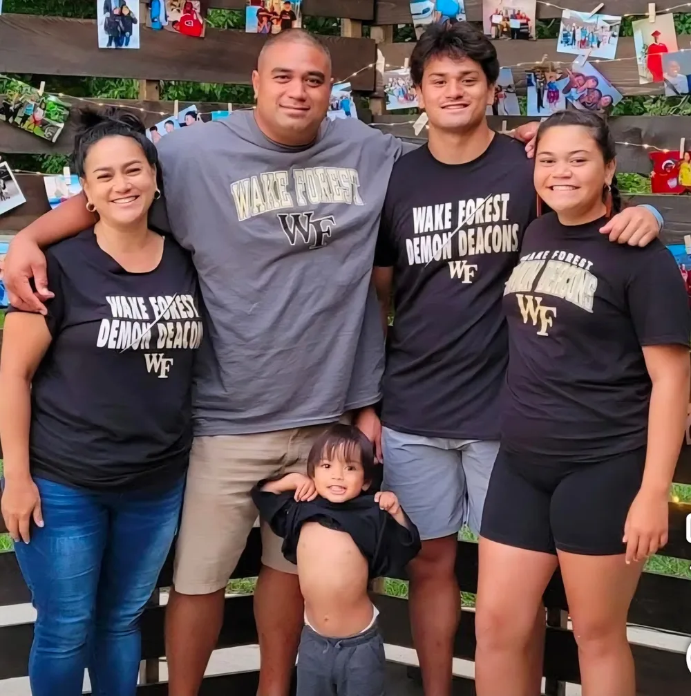 Kahau Enos with his family