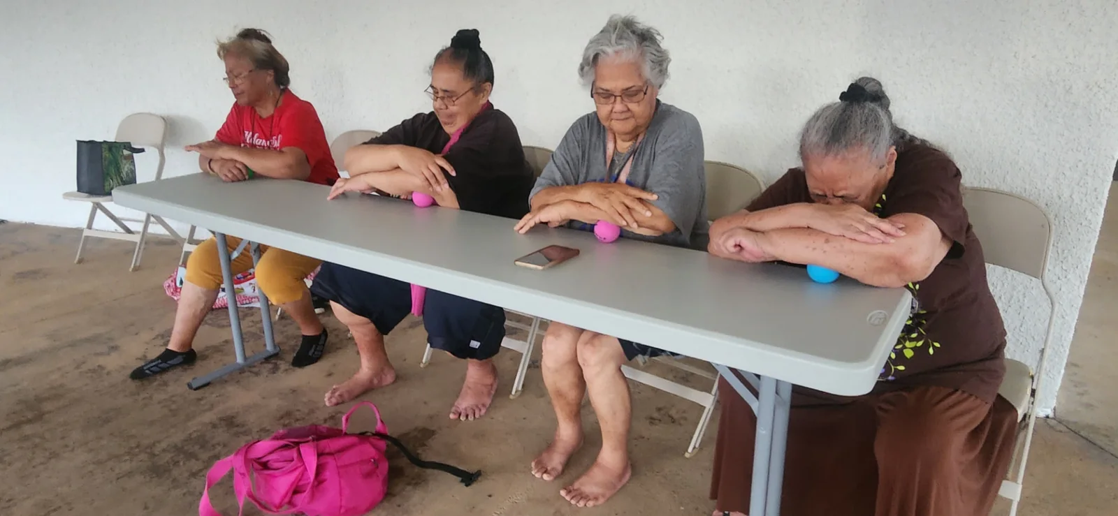 Kūpuna participating in a seated tension-release session at Lāʻie Front Chapel.