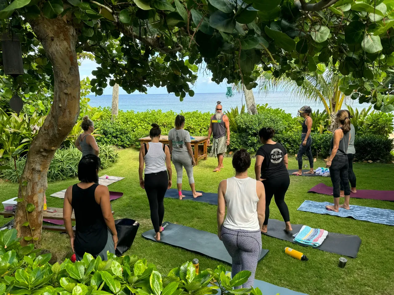 Community members participating in a CH³ Tension Release session at Ehu Kai Beach.